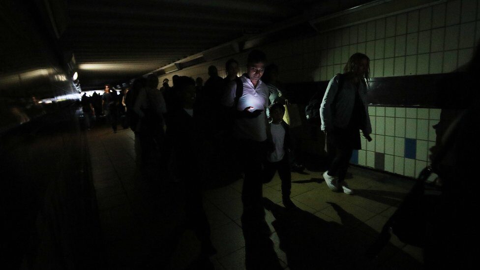 people walking in dark no lights